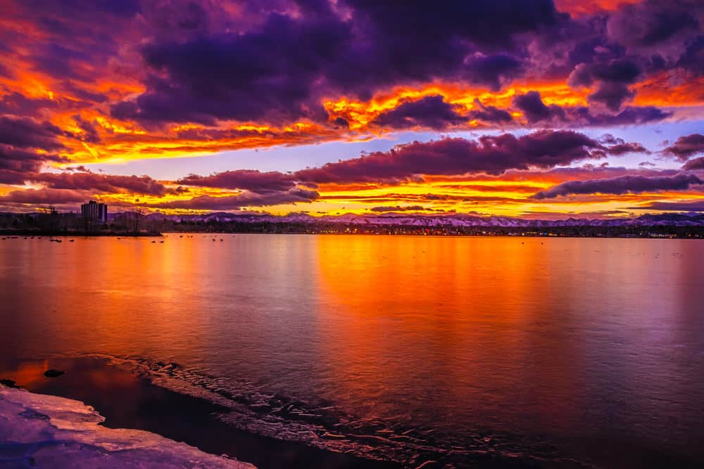 purple and red sunset over a large lake 